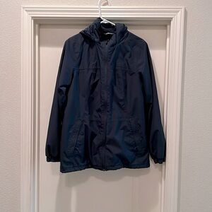 Women’s medium navy blue snow jacket with roll to conceal brimmed hood